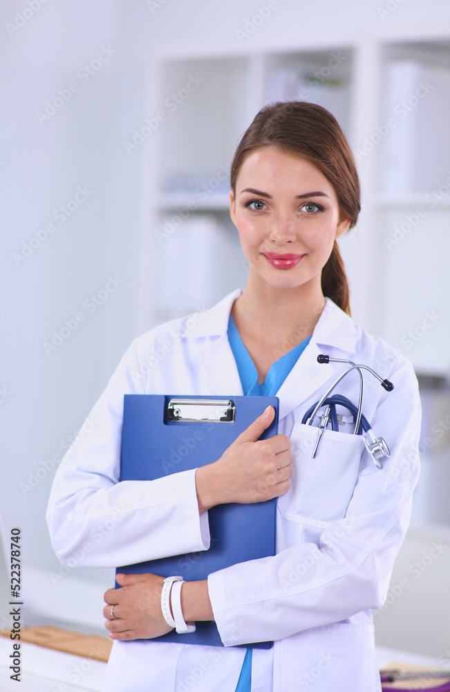 © lenets_tan - Medical team sitting at the table in modern hospital