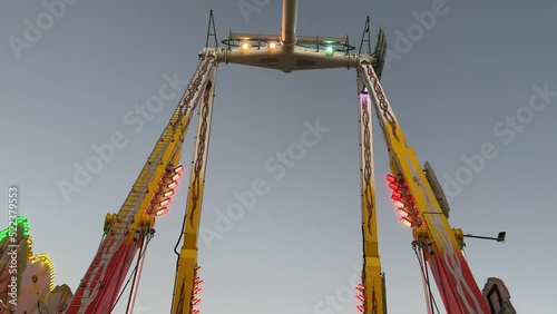 Swinging pendulum ride, passengers swinging back and forth in high speed with excitements and adrenaline rush at annual event Ekka Brisbane Showgrounds, Royal Queensland Show, Australia.