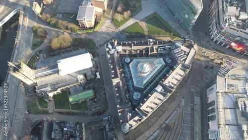 4K 60FPS Aerial drone flight showing a birdseye view of Manchester Cathedral and the Corn Exchange Building with the Football Museum in the distance photo
