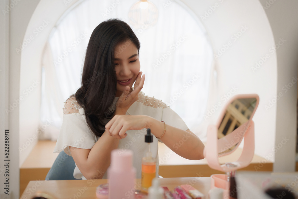 Teenager using cosmetic and try to make up following her vlogger Teenager using cosmetic and try to make up following her vlogger