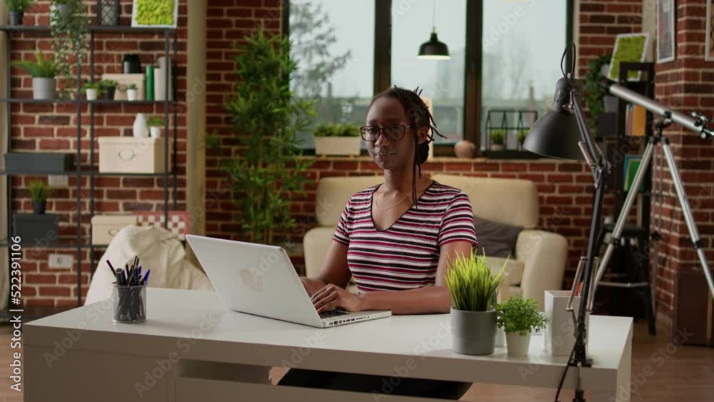 Portrait of woman freelancer working on laptop at home, doing freelance job with remote work. Company worker using startup computer network to do webinar assignment remotely in apartment. Portrait of woman freelancer working on laptop at home, doing freelance job with remote work. Company worker using startup computer network to do webinar assignment remotely in apartment.