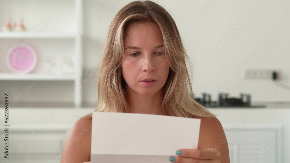 Close up of late woman reading letter and smiling. Close up of late woman reading letter and smiling.