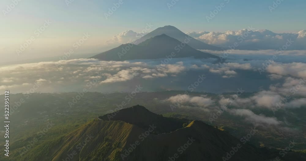 Famous volcanoes of Bali tropical island, Batur, Abang and Agung, aerial Famous volcanoes of Bali tropical island, Batur, Abang and Agung, aerial