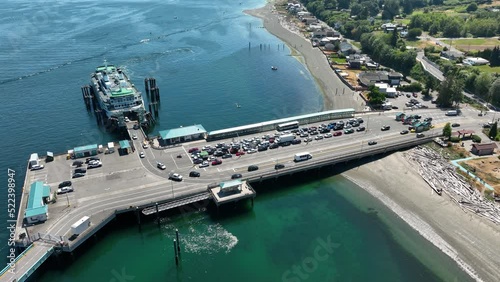 Aerial shot of vehicles leaving a docked ferry. photo