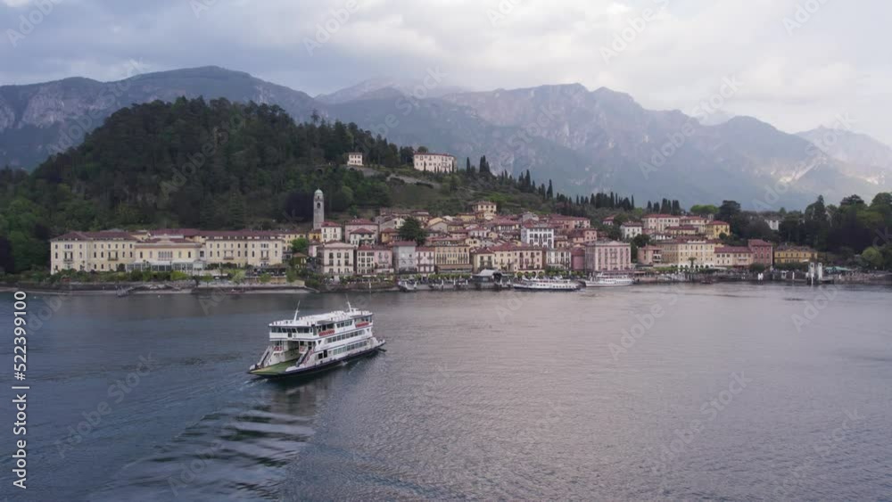 Lake Como Pontoon Ferry Boat arriving at Bellagio Town, Aerial Lake Como Pontoon Ferry Boat arriving at Bellagio Town, Aerial