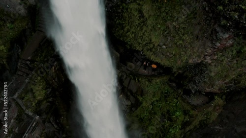 Tourists On The Pailon Del Diablo Waterfall In Baños de Agua Santa, Ecuador - drone shot