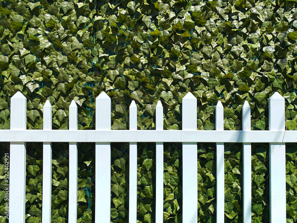 white picket fence yard green camouflage plastic net netting shade cover industrial backyard army covering