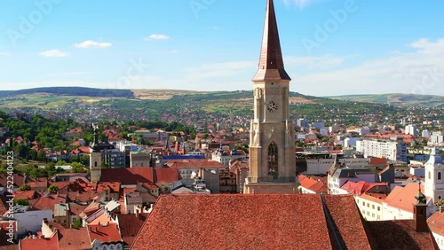 Aerial drone view of Saint Michael Church in Cluj, Romania. Cityscape, central square, old buildings photo