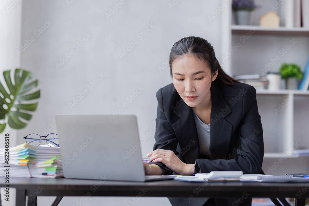 Business Asian woman working at office with documents on his desk, doing planning analyzing the financial report, business plan investment, finance analysis concept Business Asian woman working at office with documents on his desk, doing planning analyzing the financial report, business plan investment, finance analysis concept