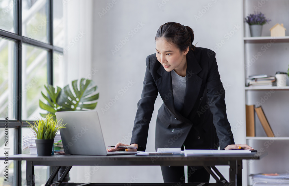 Business Asian woman working at office with documents on his desk, doing planning analyzing the financial report, business plan investment, finance analysis concept Business Asian woman working at office with documents on his desk, doing planning analyzing the financial report, business plan investment, finance analysis concept