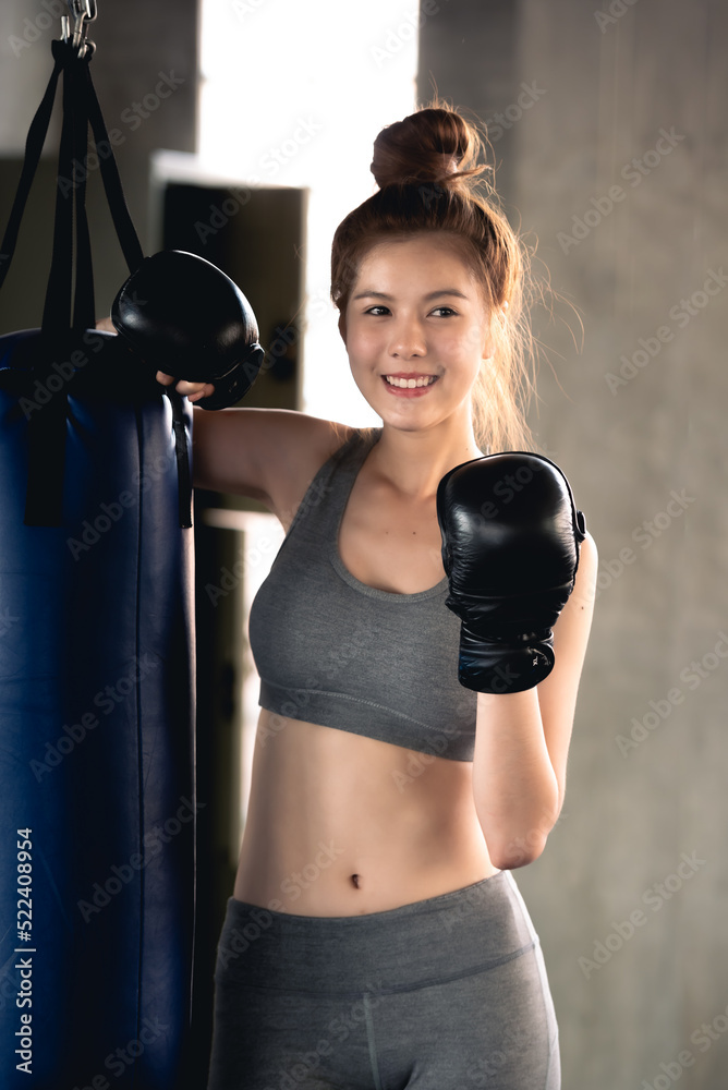 Young healthy woman workout in the gym.