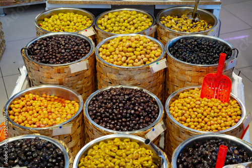 Appetizing marinated olives in a shop stall display