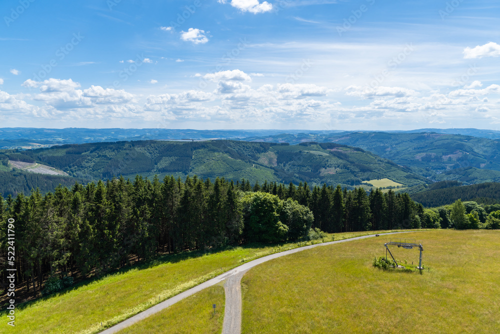 Landscape at Schomberg in Sauerland. Nature with forests and hiking trails near Sundern on the Lennegebirge.
