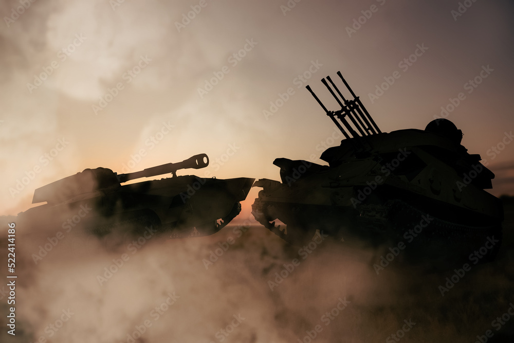 Fototapeta premium Silhouettes of armored fighting vehicle and tank on battlefield