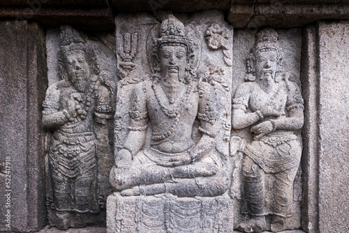 Carving Relief In Prambanan Temple. The temple is adorned with panels of narrative bas-reliefs telling the story of the Hindu epic Ramayana and Bhagavata Purana.