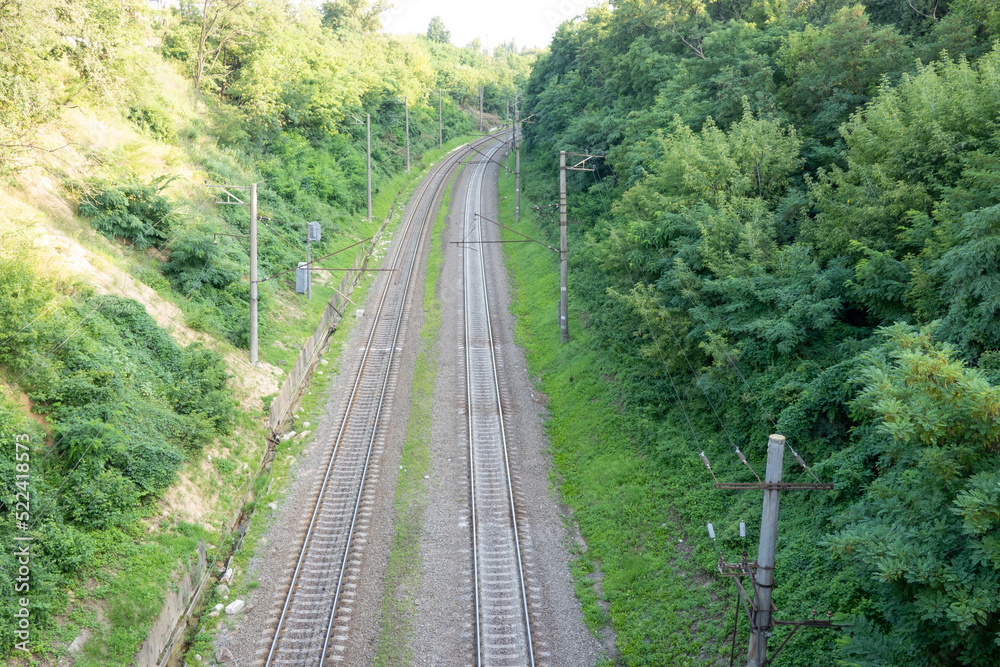 railway tracks on the road, view from above on the railway road, travelling, direction of way railway tracks on the road, view from above on the railway road, travelling, direction of way