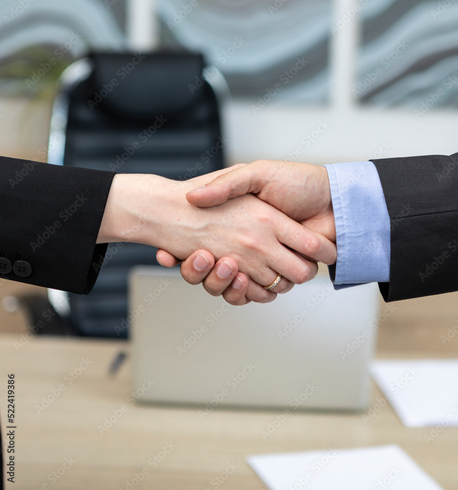 Close-up photo of handshake in the office