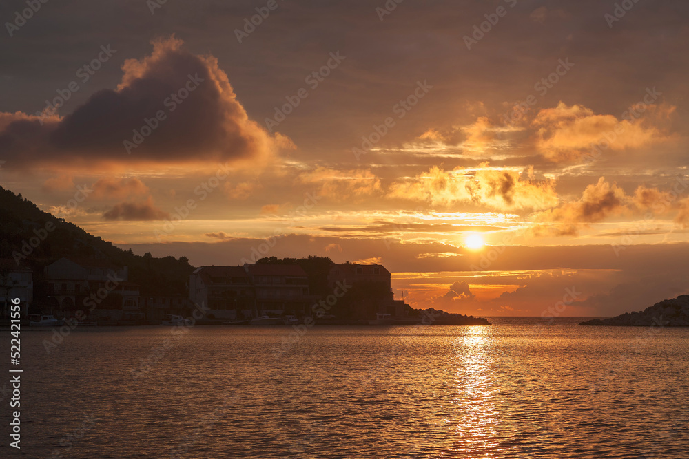 Naklejka premium Sunset over the anchorage of Zaklopatika, on the island of Lastovo, Dubrovnik-Neretva, Croatia