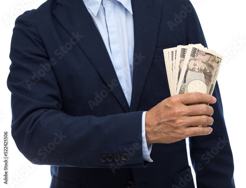 Man hand holding 10000 Japanese Yen banknote