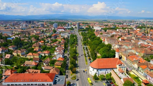 Aerial drone view of Sibiu, Romania. Roads with greenery, and residential buildings photo