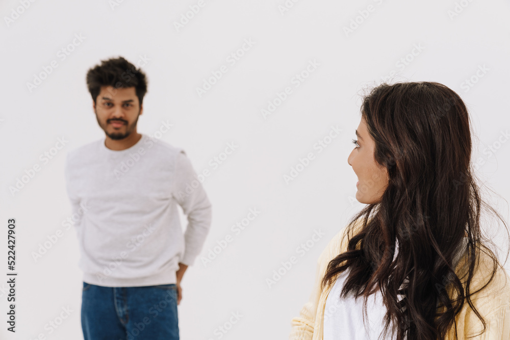 Young indian couple looking at each other while posing together Young indian couple looking at each other while posing together