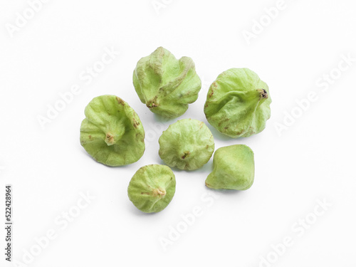 Isolated tectona grandis seeds on white background, soft and selective focus.
