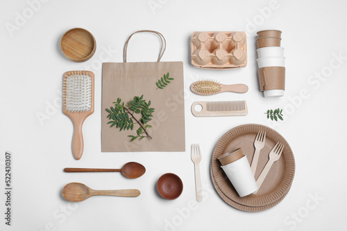 Different eco items on white background, flat lay. Recycling concept photo