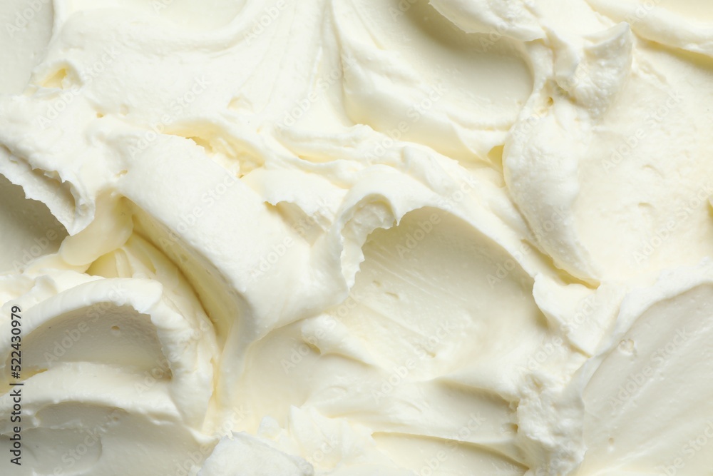 Closeup of tasty cream cheese as background, top view