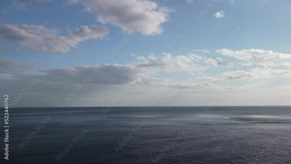 Aerial view from above on calm azure sea and volcanic rocky shores. Small waves on water surface in motion blur. Nature summer ocean sea beach background. Nobody. Holiday, vacation and travel concept Aerial view from above on calm azure sea and volcanic rocky shores. Small waves on water surface in motion blur. Nature summer ocean sea beach background. Nobody. Holiday, vacation and travel concept