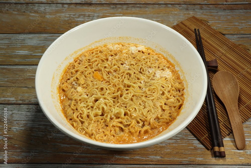 Boiled instant noodle serving in the bowl. Low cost and cheap menu. Comfortable food concept. Boiled instant noodle serving in the bowl. Low cost and cheap menu. Comfortable food concept.