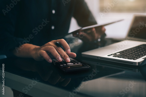 Businessmen are calculating income-expenditure and analyzing real estate investment data at office, Accounting Financial and tax systems concept.