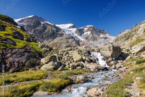 mountain creek in front of Steingletscher on Sustenpass in the Bernese Alps © schame87