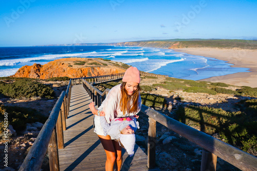 Wallpaper Mural mother with her daughter on the beach in portugal algarve Torontodigital.ca