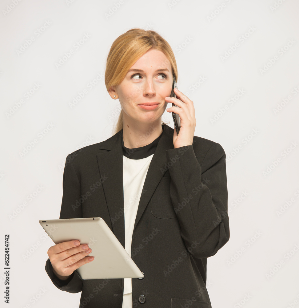 young woman in business clothes is using a tablet isolated young woman in business clothes is using a tablet isolated