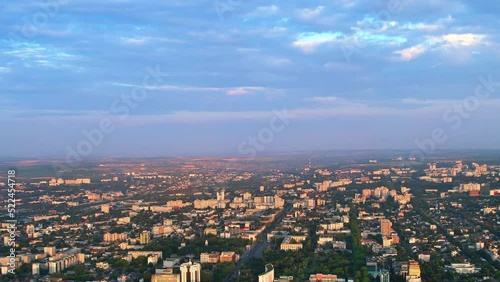 Aerial drone view of Chisinau downtown at sunset. Roads, greenery, multiple buildings. Moldova photo