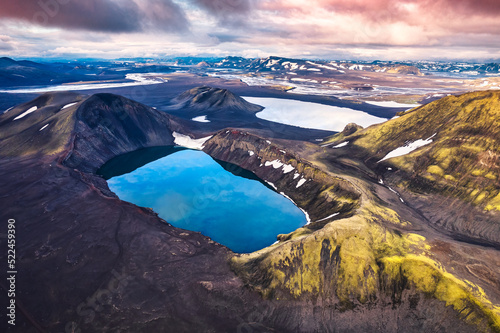 Hnausapollur or Blahylur volcano crater with blue pond on Icelandic highlands in the sunset on summer at Iceland