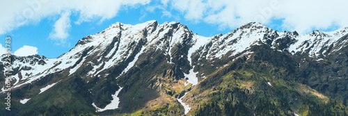 A high mountain on a blue sky background