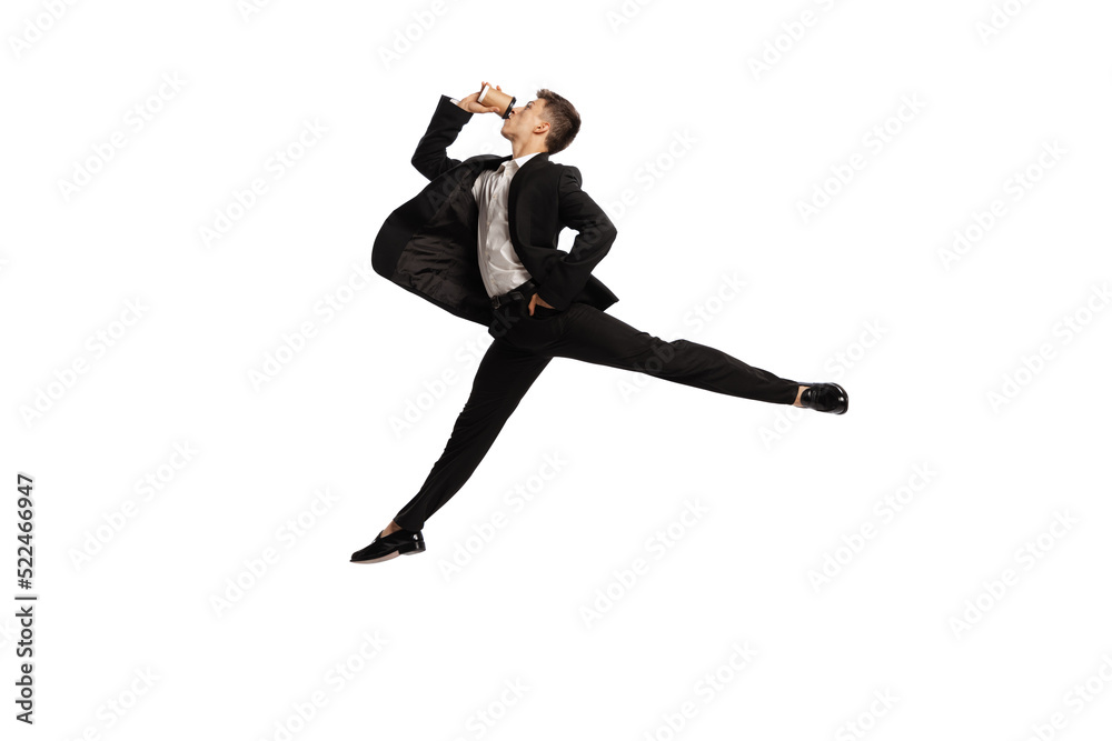 Dynamic portrait of young office worker in business suit in action isolated over white background. Finance, aspiration, business, job concept. Dynamic portrait of young office worker in business suit in action isolated over white background. Finance, aspiration, business, job concept.
