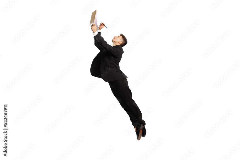 Sign contract. Young office worker in business suit jumping with papers isolated over white background. Finance, aspiration, business, job concept.