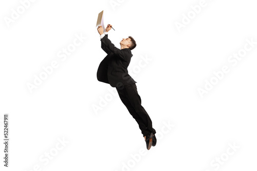Sign contract. Young office worker in business suit jumping with papers isolated over white background. Finance, aspiration, business, job concept.