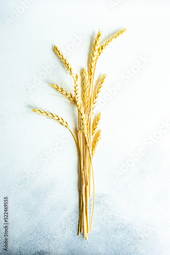 Overhead view of ears of wheat on a table photo