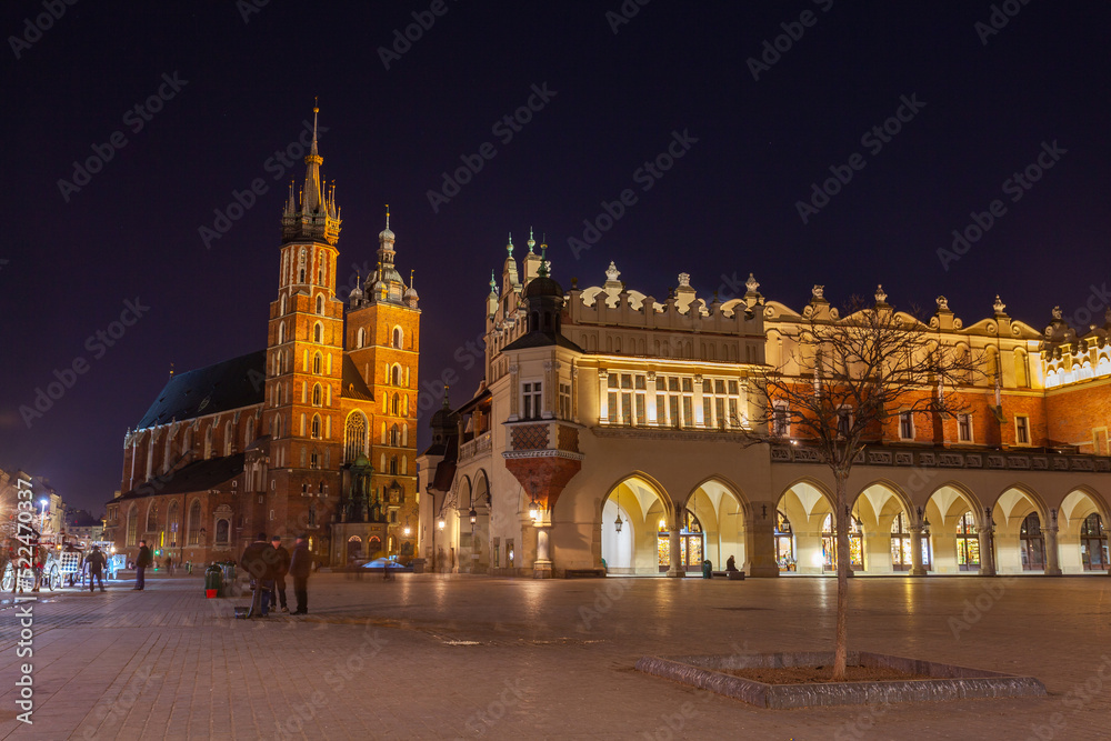 Old town square in Krakow at night, Poland. St. Marys Basilica