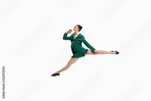 Stylish young woman in business style outfit in motion isolated over white background. Emotions, finance, aspiration, business, job concept. © master1305