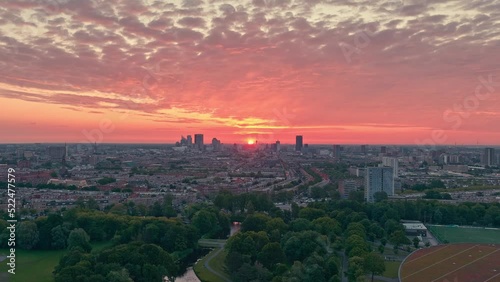 The sun coming up in The Hague, Netherlands, filmed at the zuiderpark (southern park) of the city photo