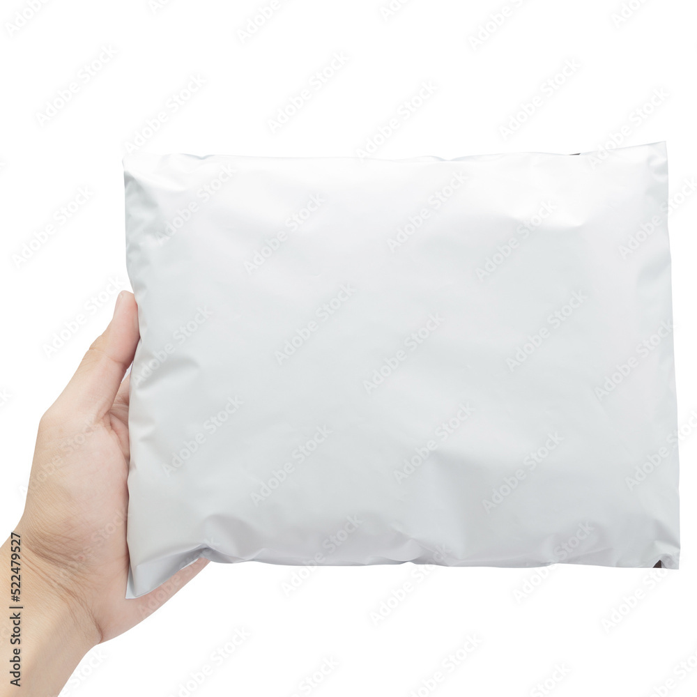 Hand holding blank white plastic bag package mockup, Cutout.