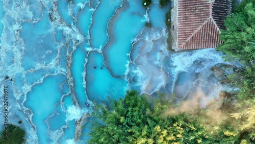 View from above, stunning aerial view of Le Cascate del Mulino, a group of beautiful hot springs in the municipality of Manciano, Tuscany