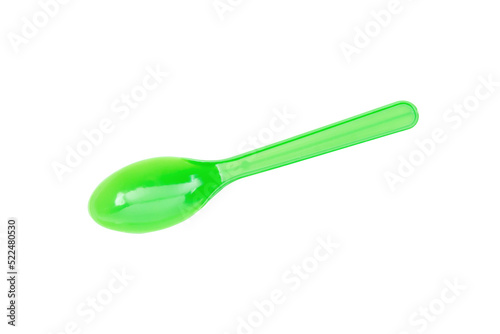 Green plastic spoon isolated on white background.