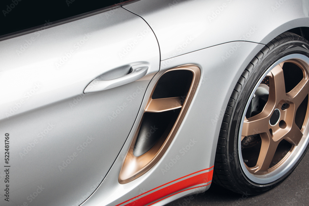 Modern sports car fender with air intake Modern sports car fender with air intake