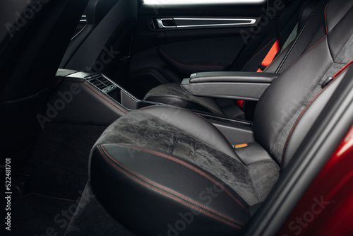 Luxury car rear seats row. Expensive car leather seats. Cozy and comfortable seats of vip transfer car  © Moose