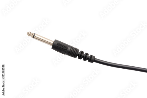 Guitar audio jack with black cable isolated on white background.